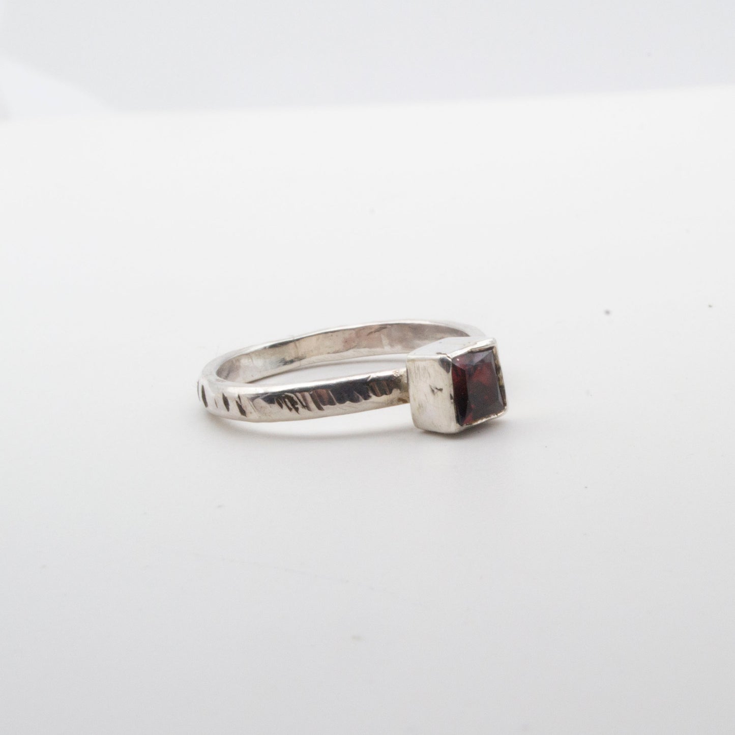 Garnet faceted square ring with textured band Size L