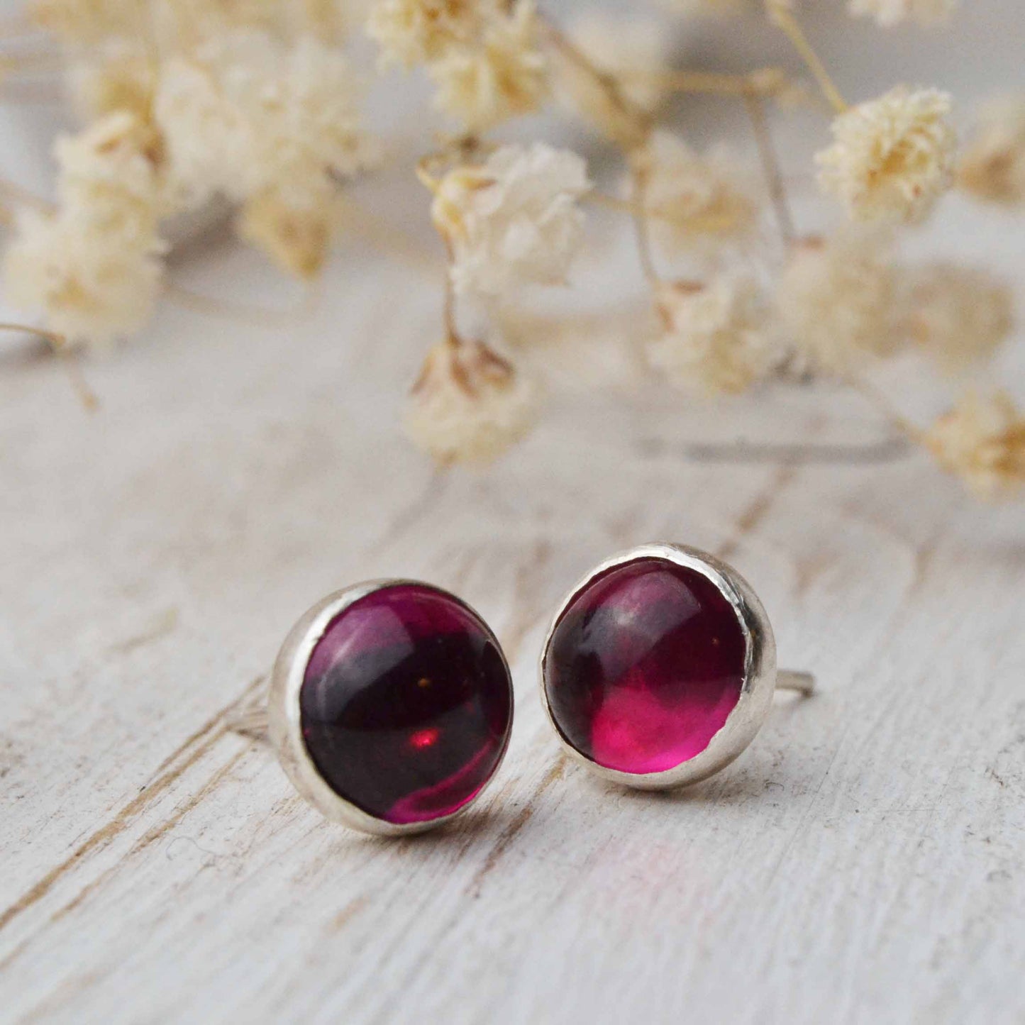 Ruby stud earrings in sterling silver