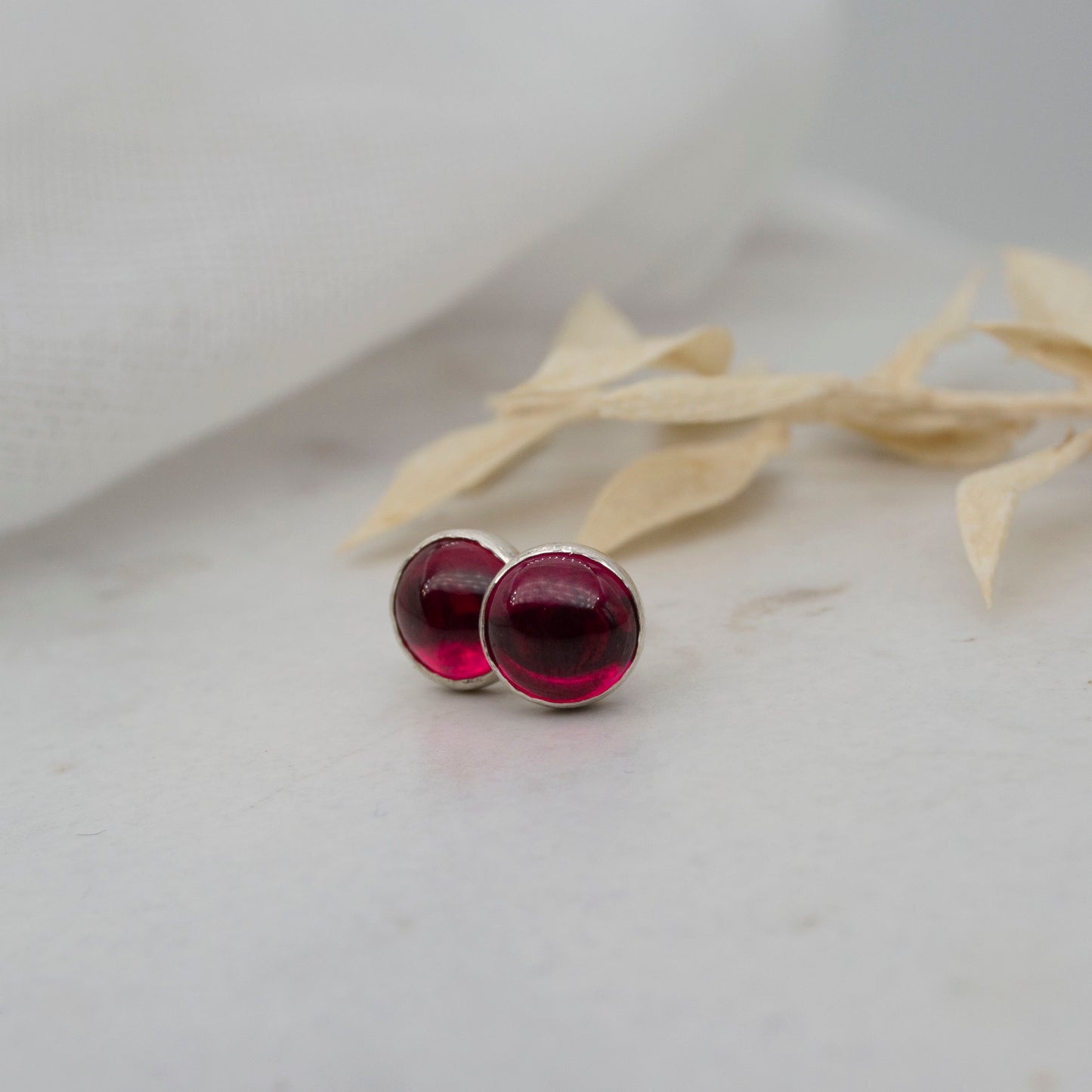 Ruby stud earrings in sterling silver