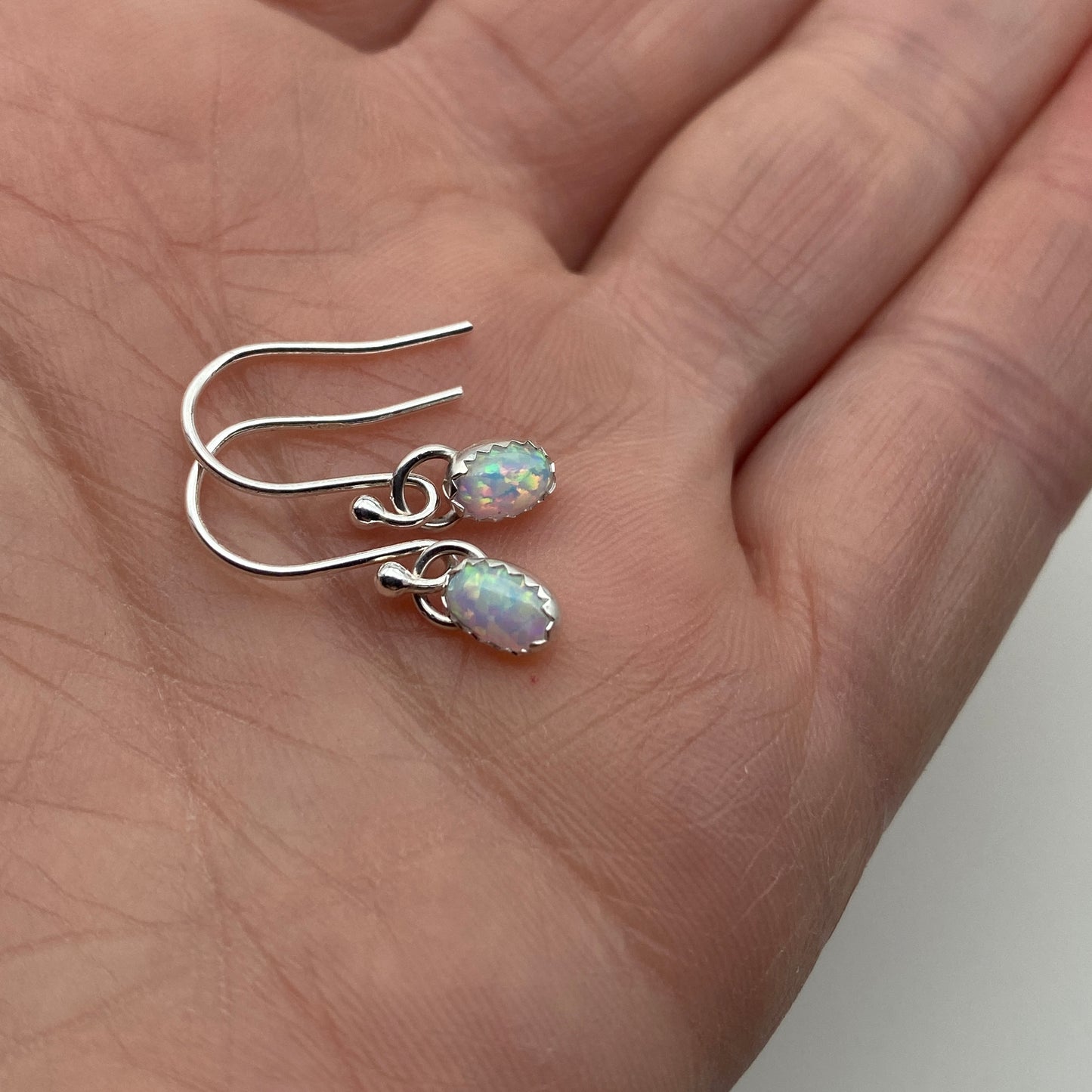 Oval gemstone dangle earrings