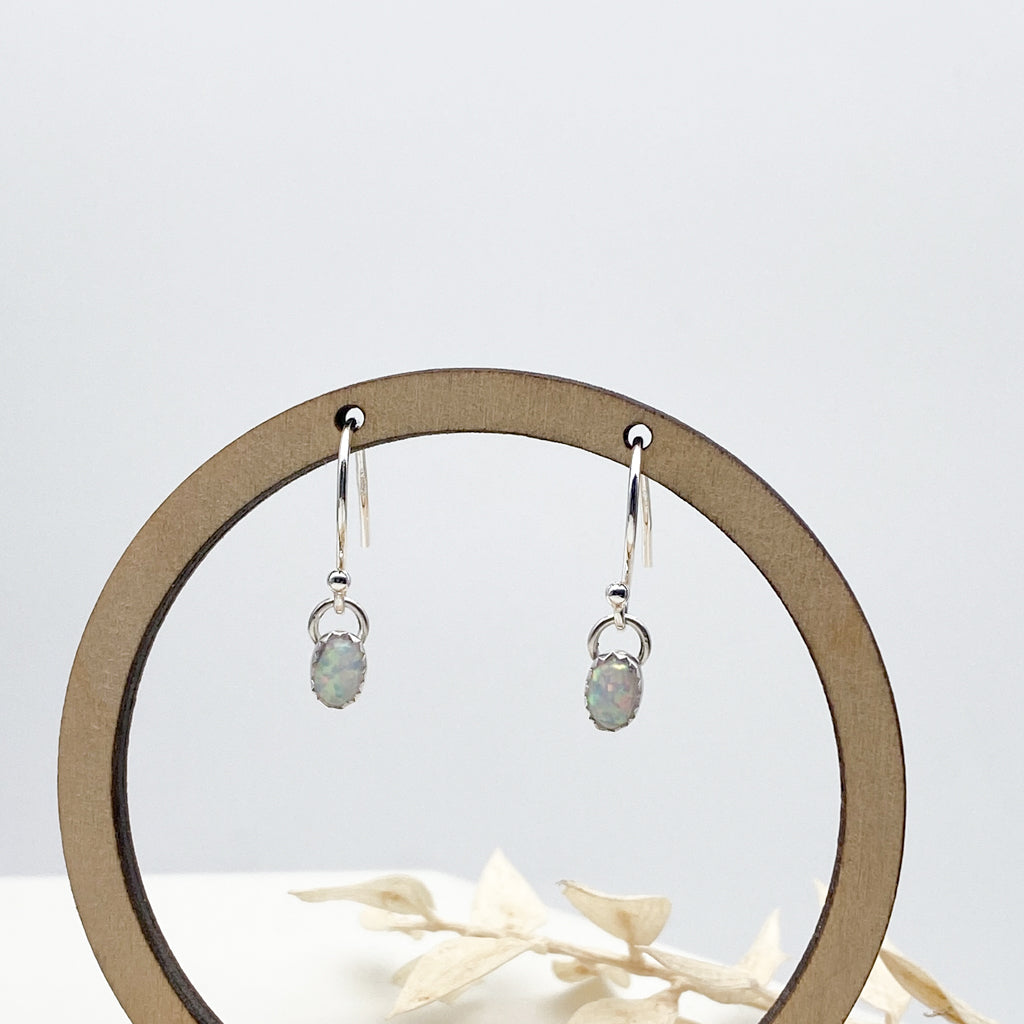 Oval gemstone dangle earrings