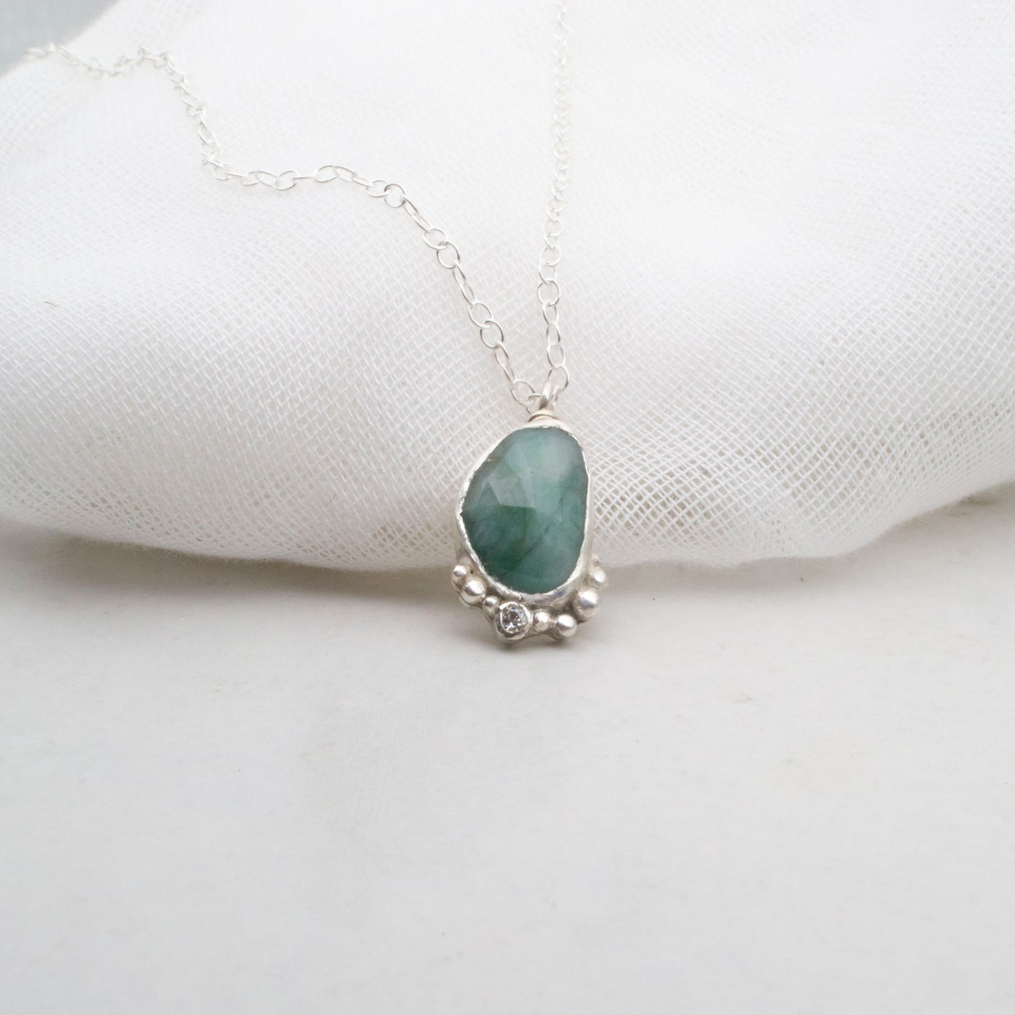 Emerald with moisanite