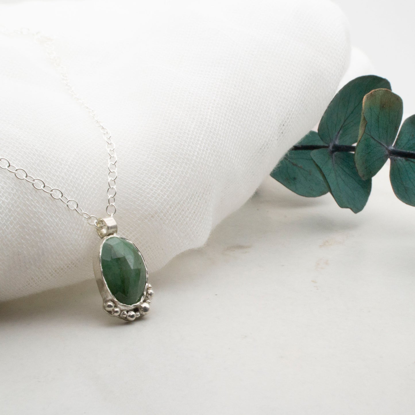 Emerald with silver bubbles