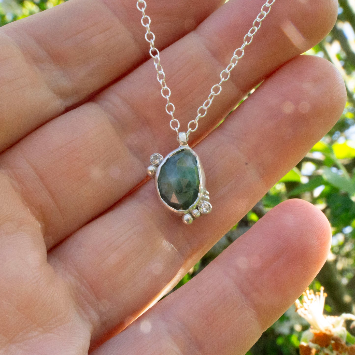 Emerald komorebi pendant with moonstone and cubic zirconia