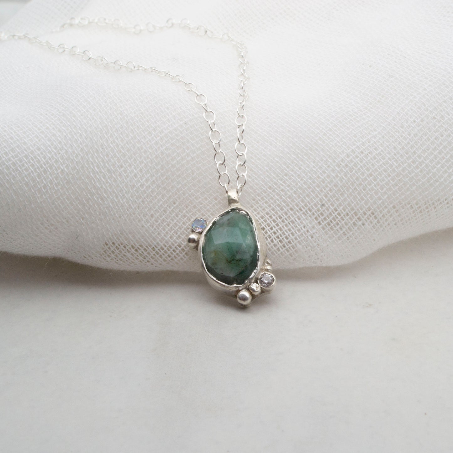 Emerald komorebi pendant with moonstone and cubic zirconia