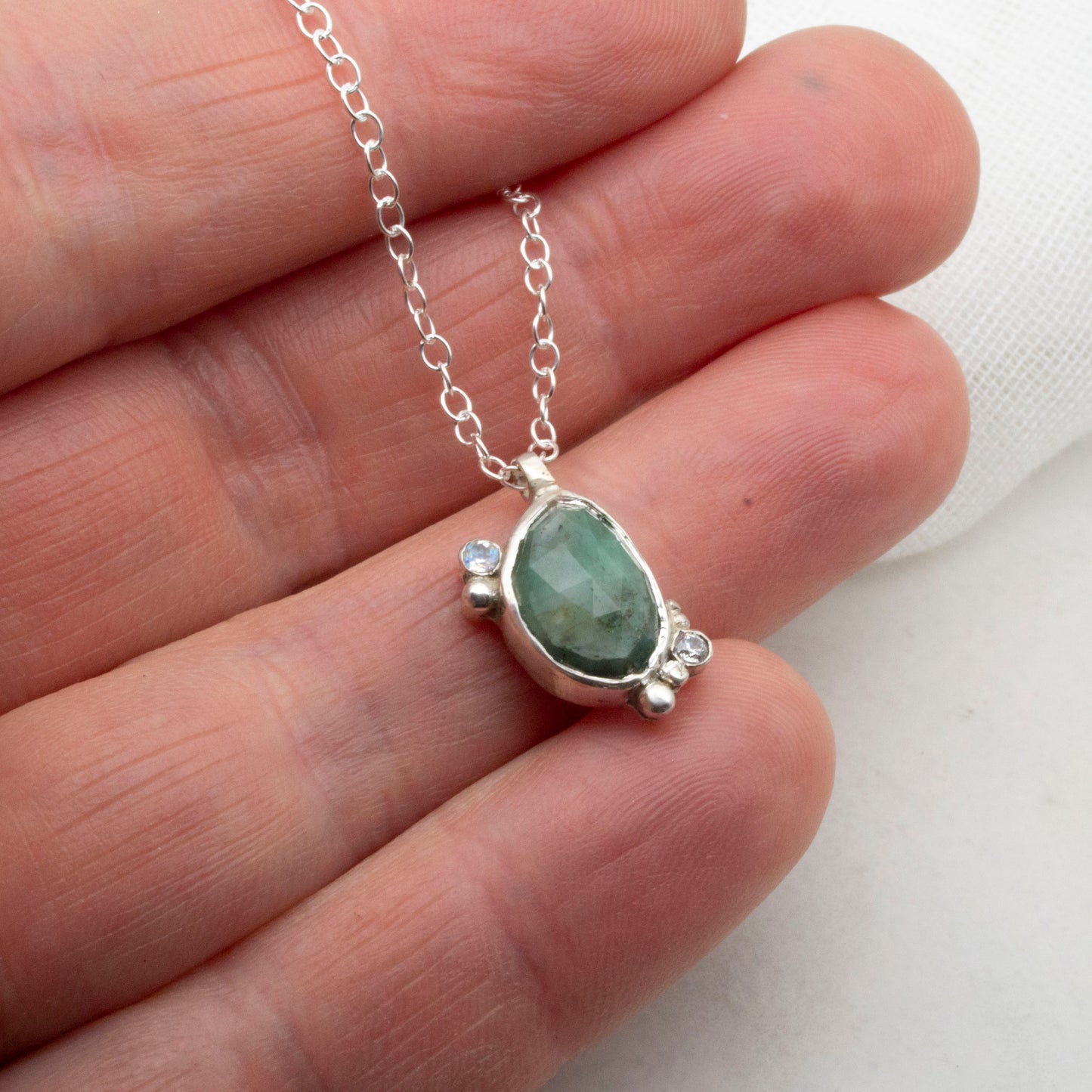 Emerald komorebi pendant with moonstone and cubic zirconia