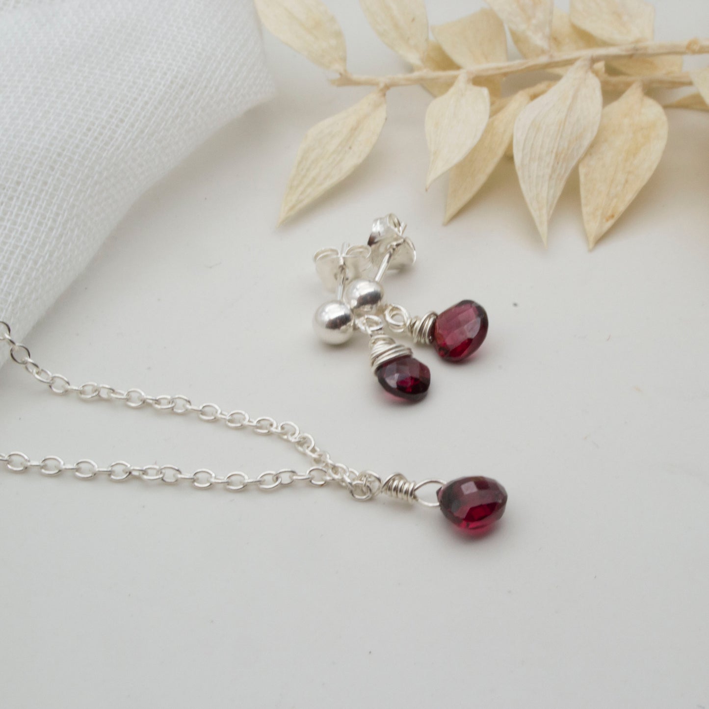 Dainty little garnet drop stud earrings