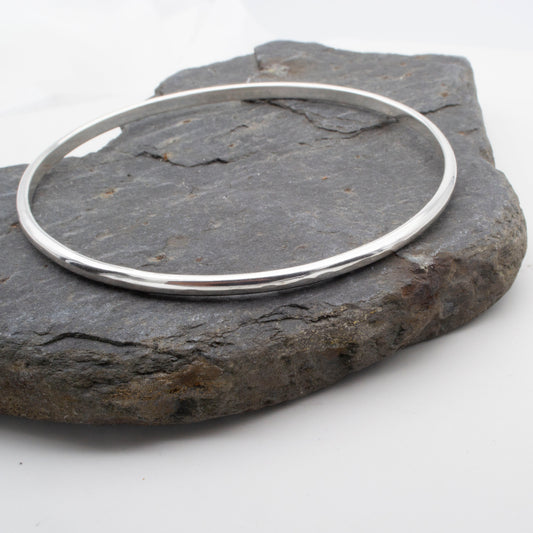 silver bangle with a hammered finish