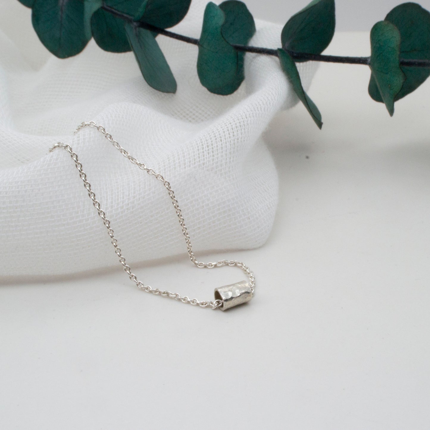 Hammered Silver Tube Necklace – Minimal with a Twist