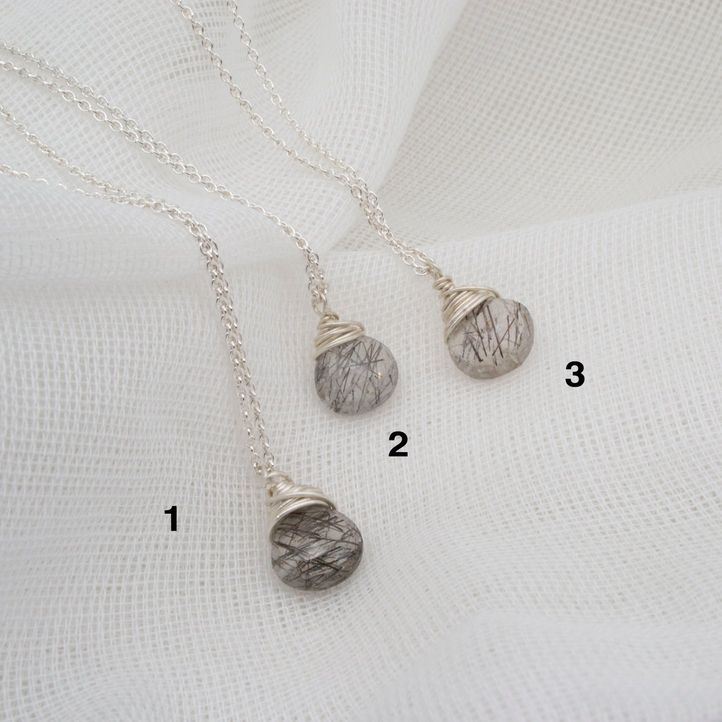 Tourmalinated quartz pendants