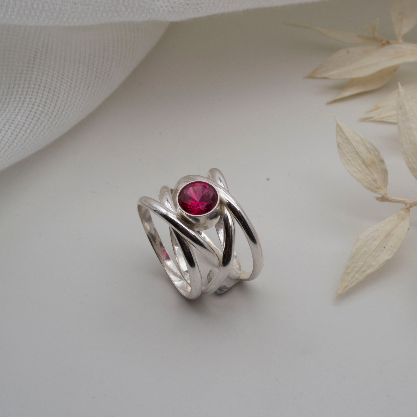 Spiralling gemstone ring