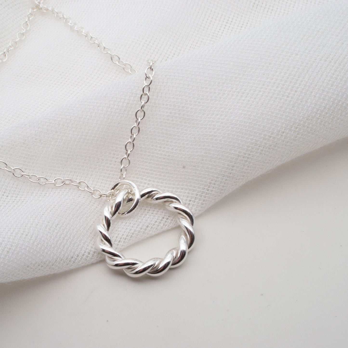 Entwined Silver Circle Pendant – A Symbol of Connection