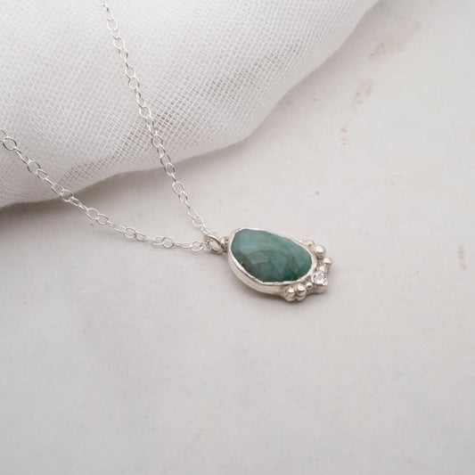 Emerald with moisanite