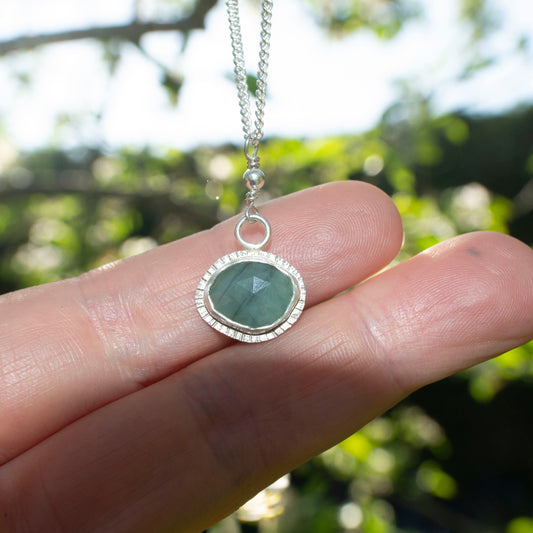 Framed emerald pendant necklace