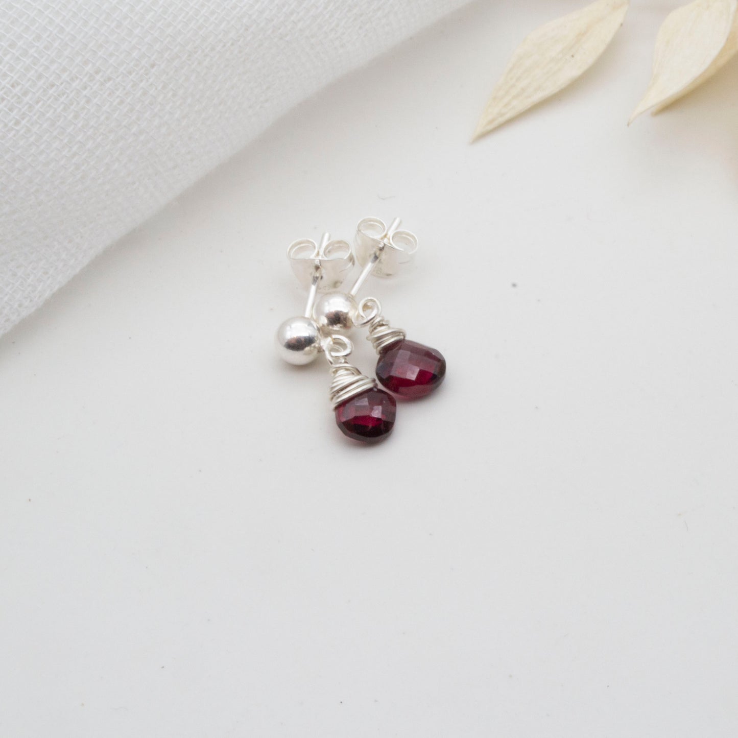 Dainty little garnet drop stud earrings