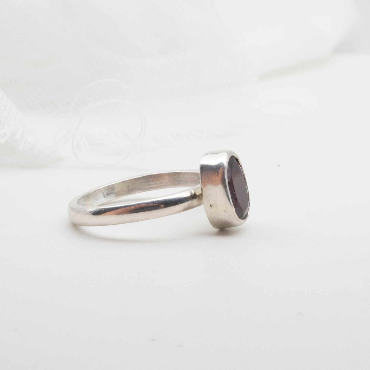 Garnet oval faceted ring - size J