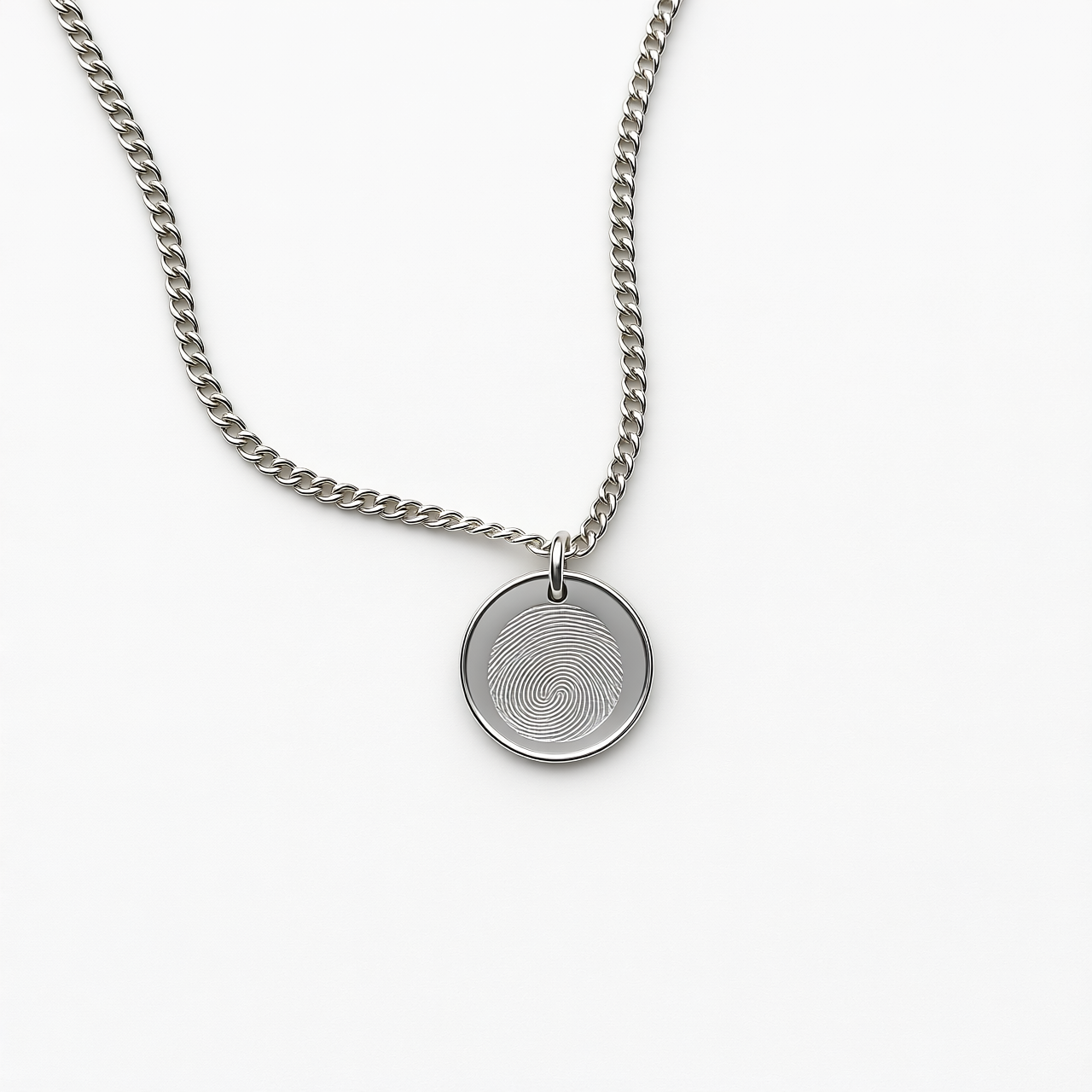 Silver necklace with a round pendant on a white background