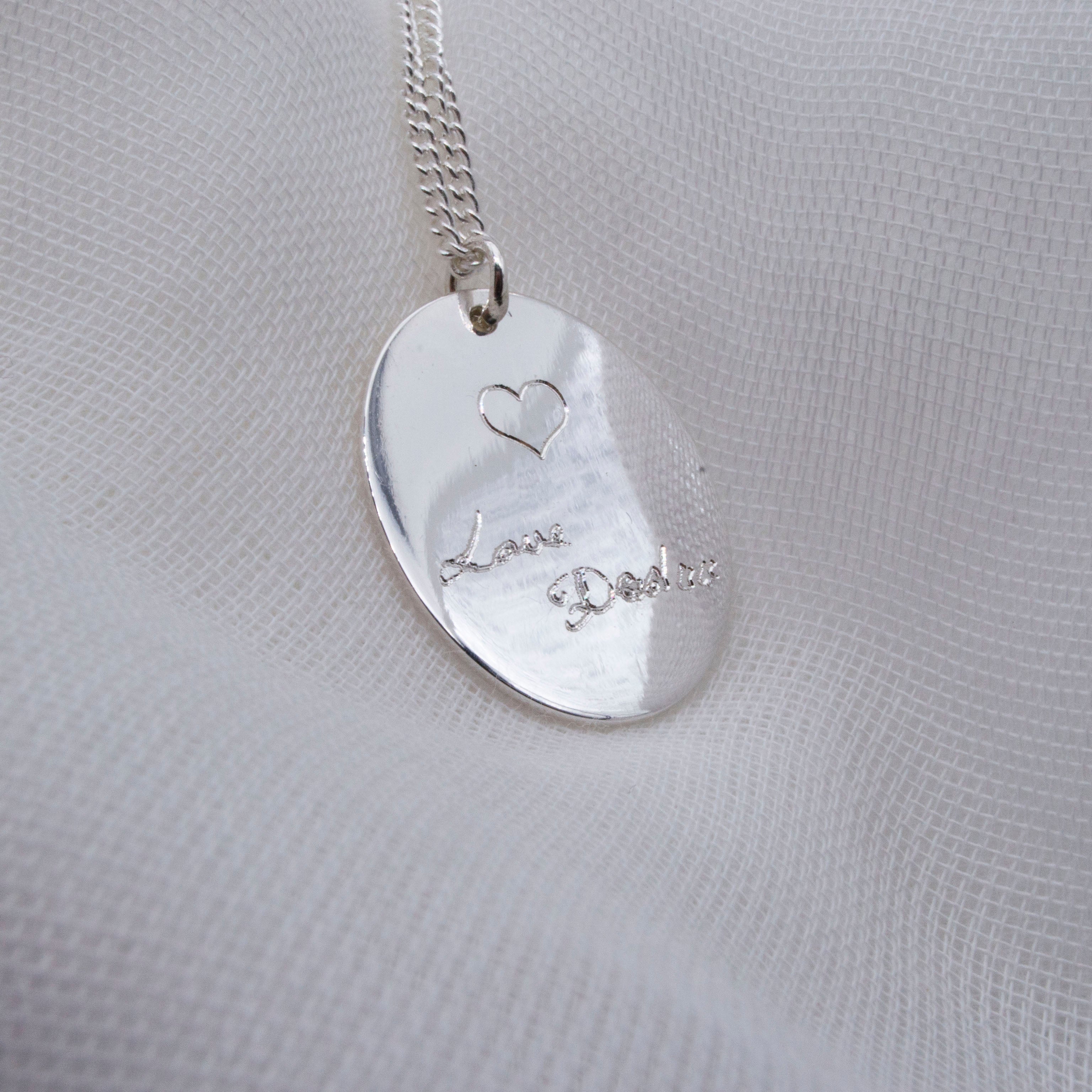 Load video: handwriting necklaces in sterling silver hanging and spinning slowly