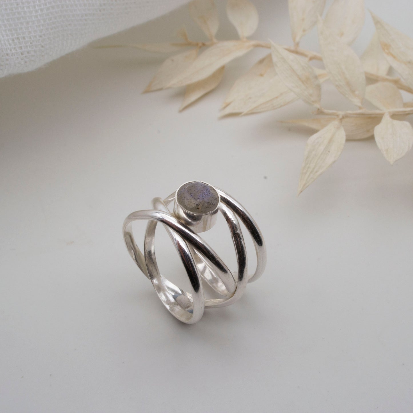 Spiralling gemstone ring