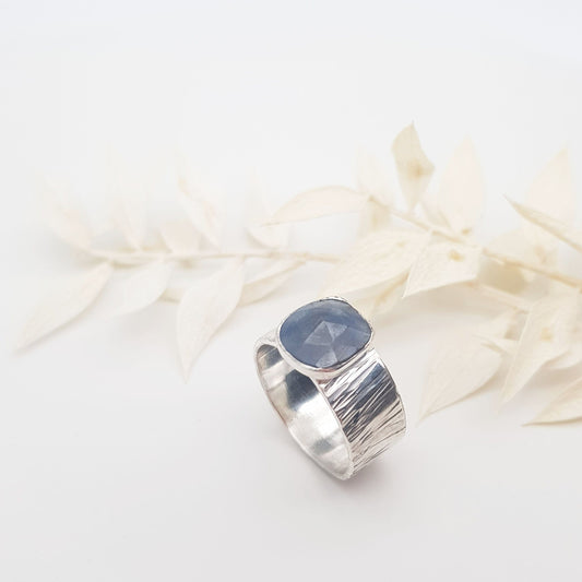 Becky Pearce Designs Grey-blue sapphire on textured wide band silver ring