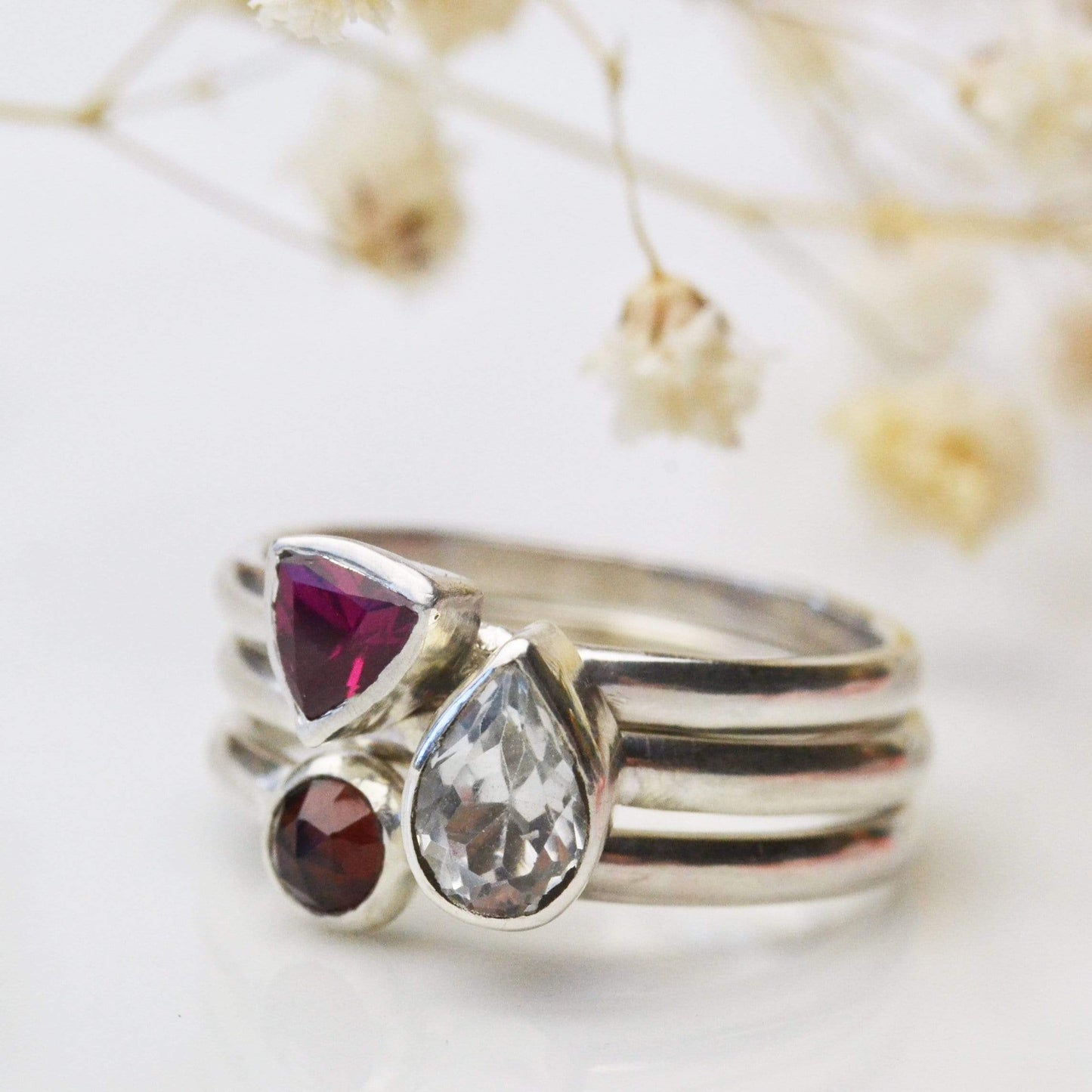 Becky Pearce Designs Rings Set of birthstone stacking rings with a trillion, pear and rose cut gemstone